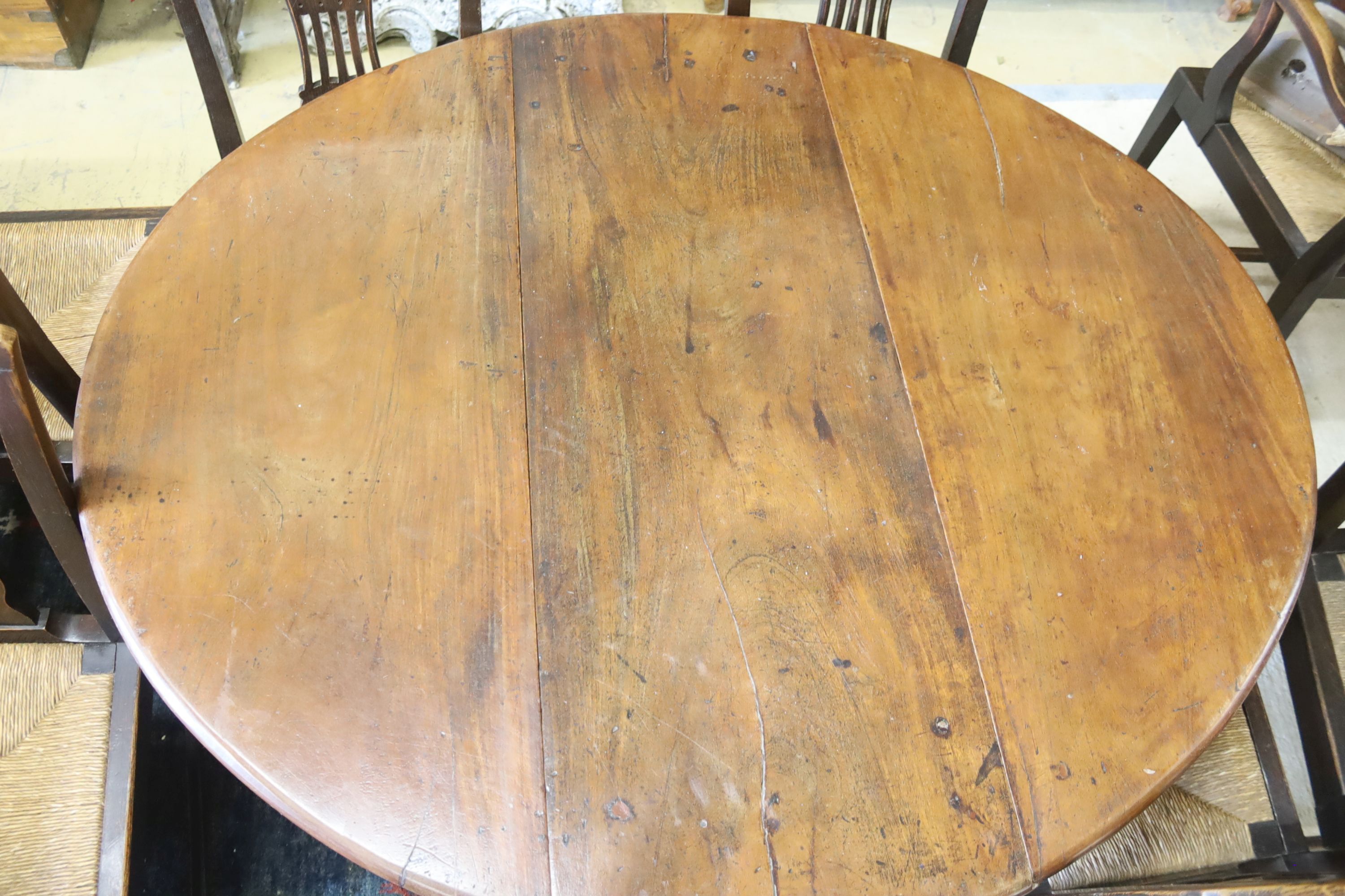 An 18th century mahogany oval drop-flap dining table, length 134cm extended, width 120cm, height 71cm